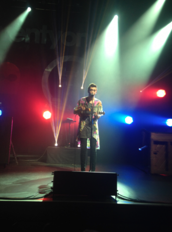 The lead singer, Tyler Joseph performing with a ukulele.