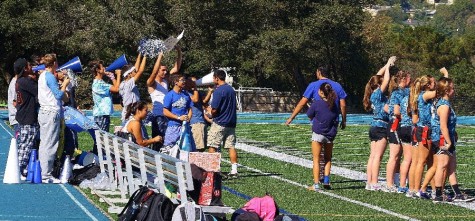 For the third year in a row, the team of the current junior class reigned champion in Powderpuff football. The male cheerleaders encourage their team to victory in their first match against the freshmen.