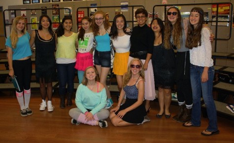 The ladies of Treble Clef show their spirit with outfits from many different times on Decades Day.