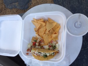 Nikko's tacos come with a large side of chips and different dips.