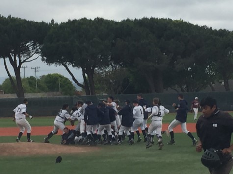 Carlmont tackles each other after Bologna hits the game winning RBI.
