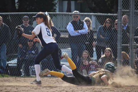 Kinsey Cook picks off a Capuchino player for a double play.