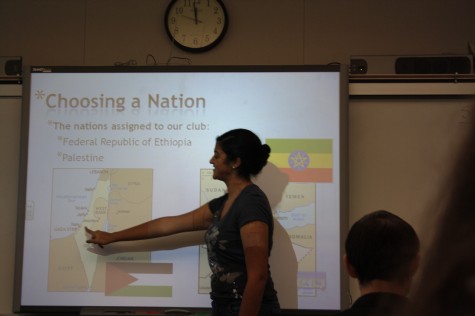 Deepti Bansal, president of the Model UN club, presenting her powerpoint to members.