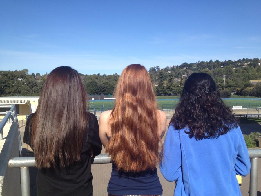 Three Carlmont girls show off their natural hair