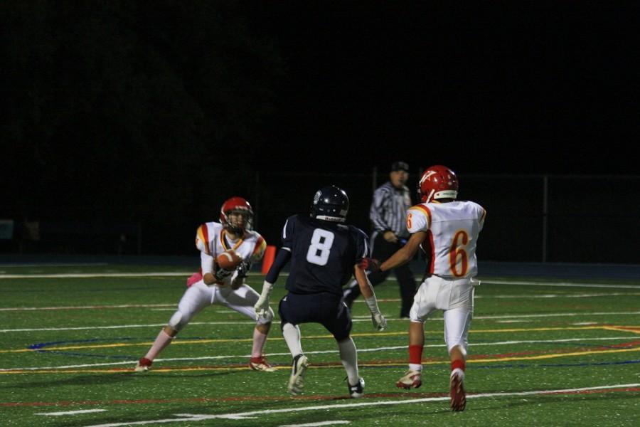 Matt Stalun (8) in pursuit of wrapping up a Mills receiver 