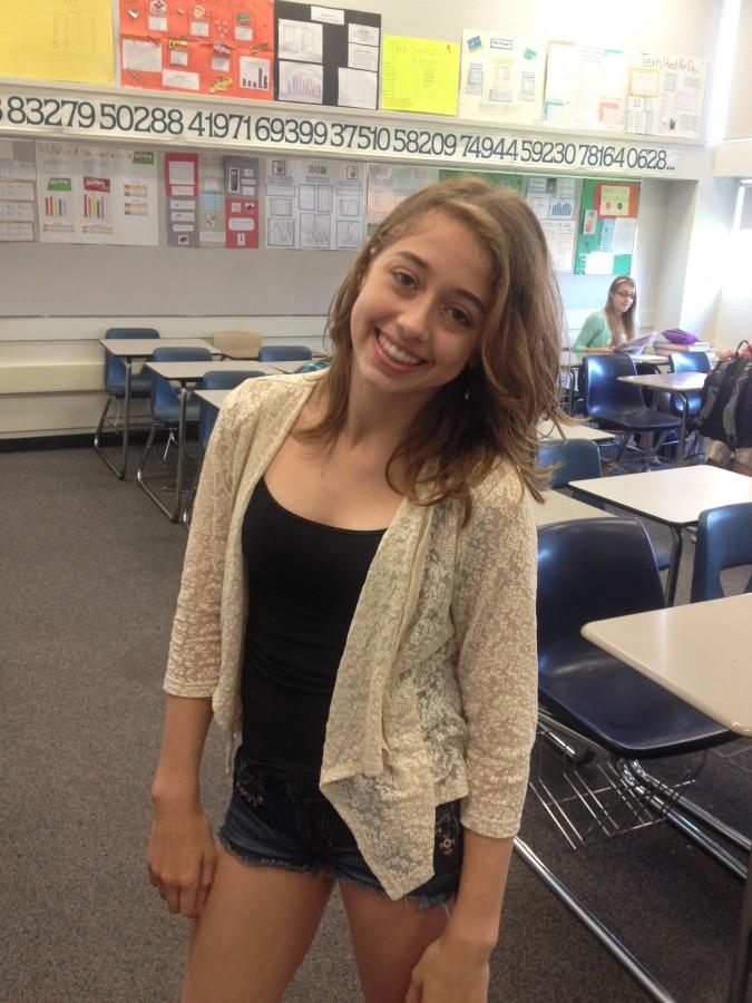 Sophomore Hannah Knoot wearing a white cardigan