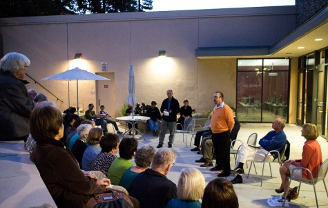 Candidate Eric Reed explains the necessity of an engaged community in the amphitheater of the Belmont Library.