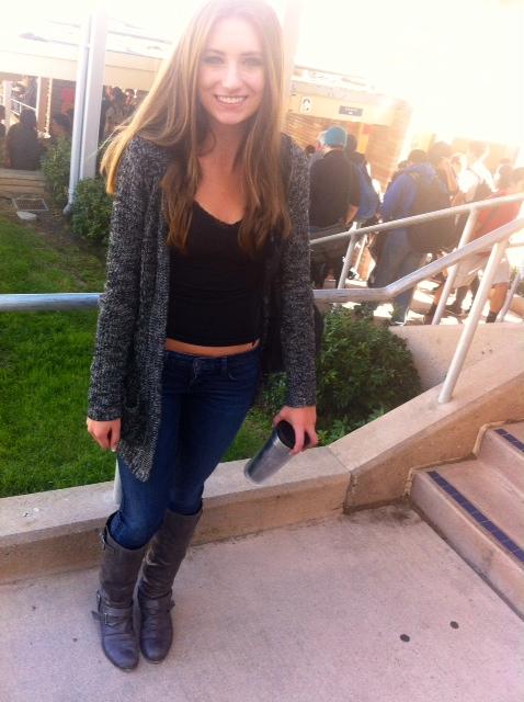 Junior Vinka Radich in her comfy, grey open-knit sweater, paired with boots and jeans