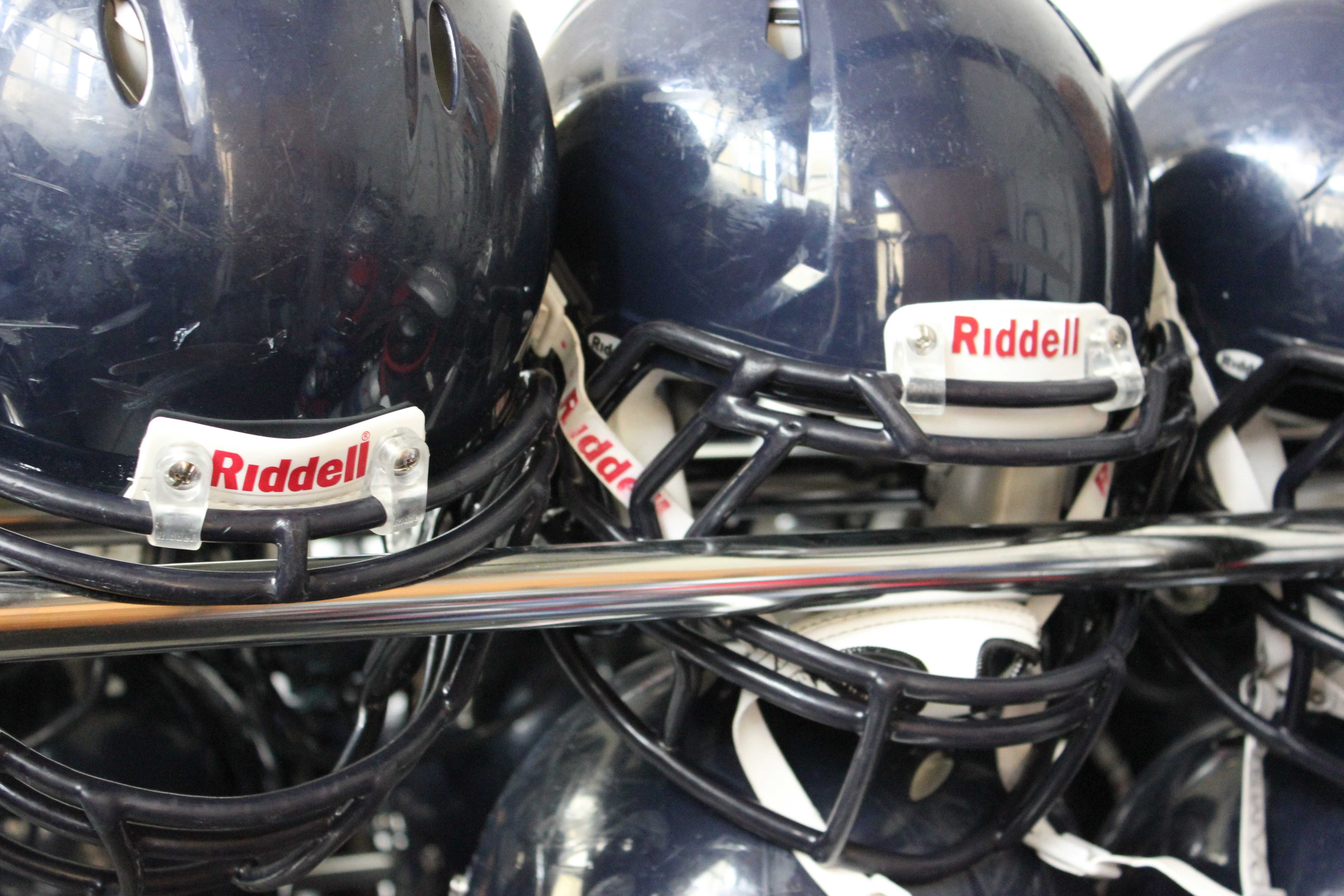 Carlmonts football team wears helmets to decrease the risk of concussions.