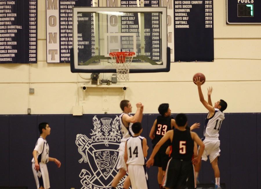 Sophomore Tyler Brandenburg attempts a lay up in the fourth quarter.