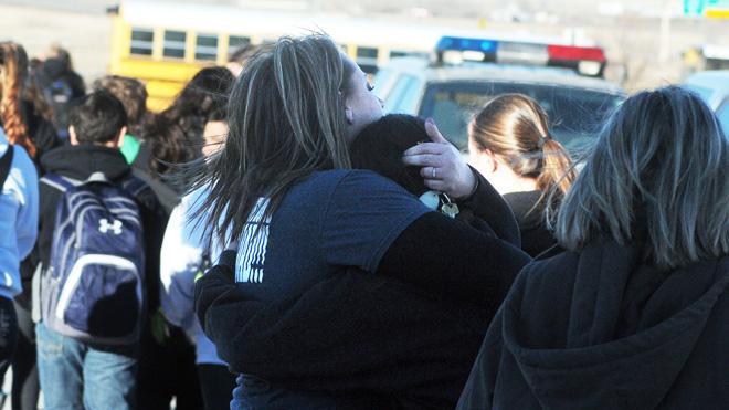 Students are escorted from Berrendo Middle School following the shooting, Tuesday, Jan. 14, 2014.