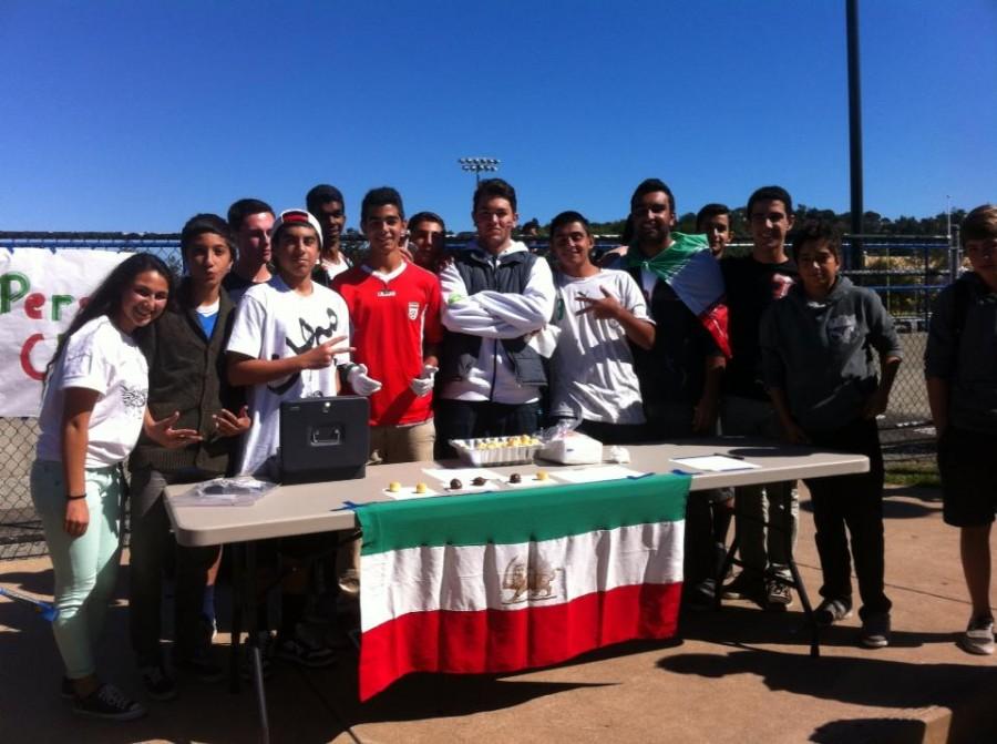 Persian club poses after selling every piece of their food at the clubs fair.