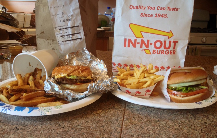 Five Guys and In-N-Out burgers and fries side by side.