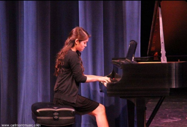 Christina Galisatus playing the piano at Chamber music night at Carlmont. Photo credit to Carlmont Music.