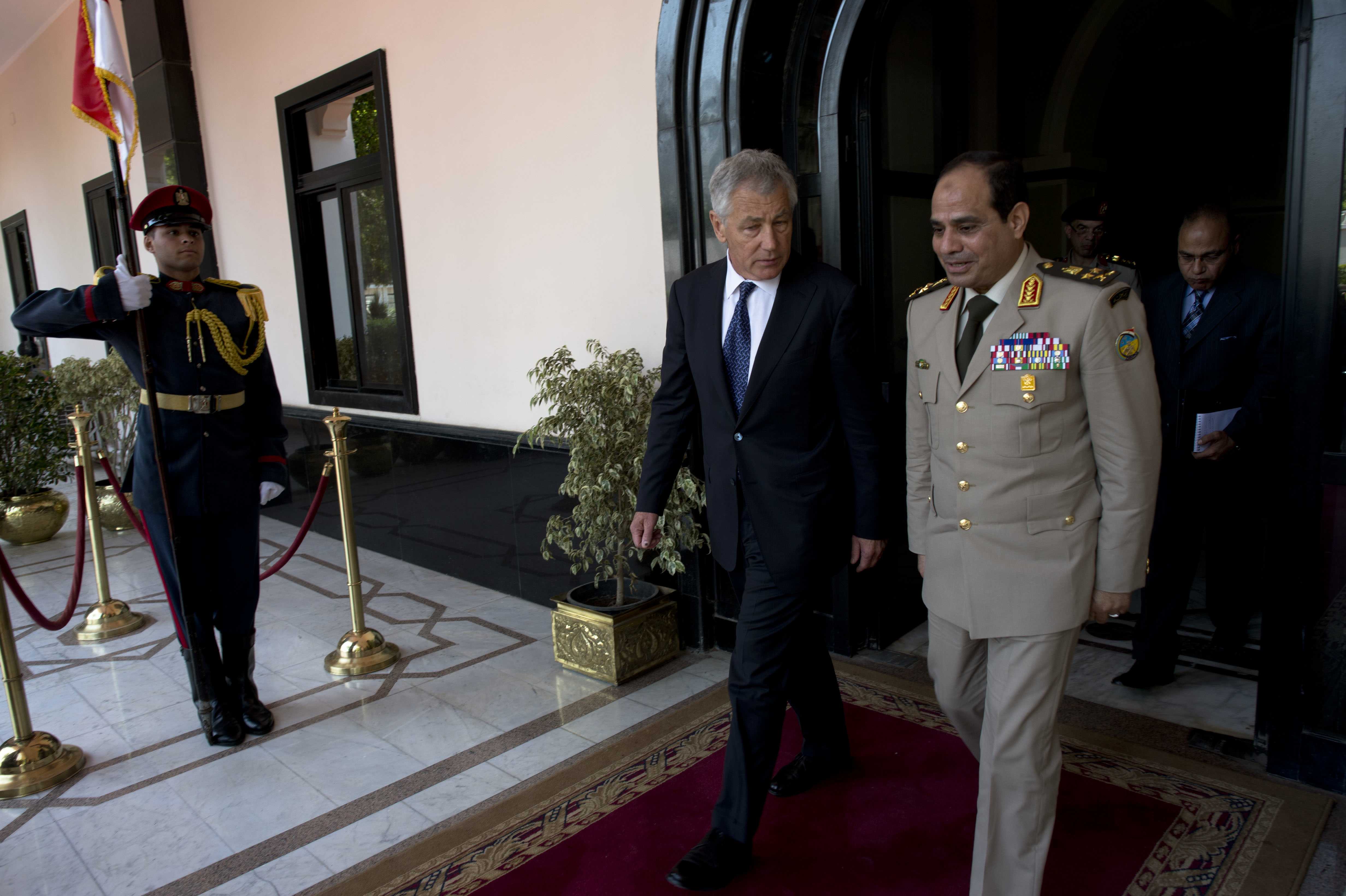 Presidential candidate Abdel Fattah al-Sisi walks alongside United States Secretary of Defense Chuck Hagel in Cairo, Egypt. Image courtesy of Creative Commons Search.