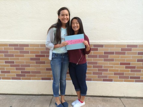 Feminist Club members, Sophomores Evelyn Lawrence and Sydney Pon, hold up the equality sign.