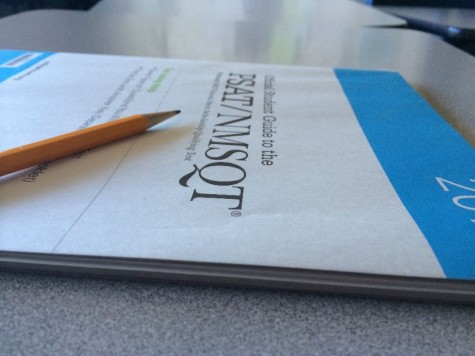 Complimentary practice booklets are handed out to students to help prepare for the PSAT 
