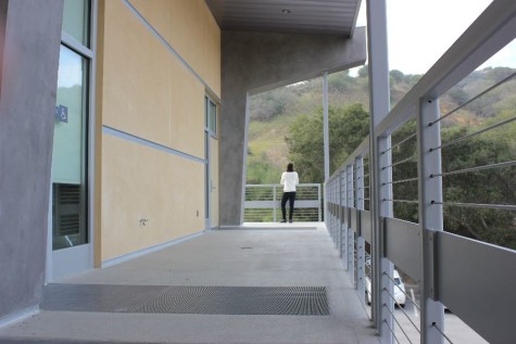 Junior Sophie Haddad stands on the balcony, overlooking the scenery of hills behind campus.