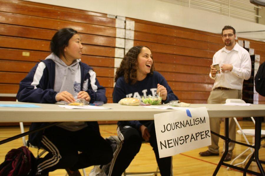 Junior Alyssa Fagel and senior Ashley Kawakami represent the Journalism table. 
