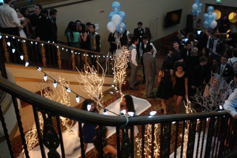 Students wait in the lobby before the dance for the coat-check and pictures.