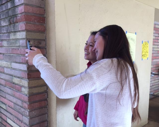 Sophomores Jill Patrucco and Brittany Cheung take a selfie for a Snapchat.