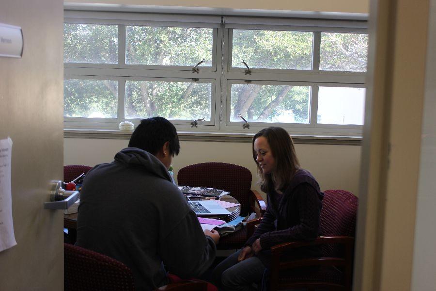 Counselor Kristin Vernon meets with a student to talk about college options. 