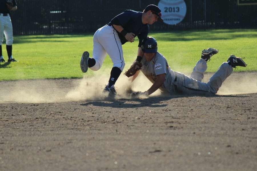 Second baseman Aaron Albaum sweeps across the base as he attempts to tag out Menlos baserunner stealing second base.