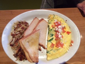 The spinach and salsa topped omelet was tastefully presented.
