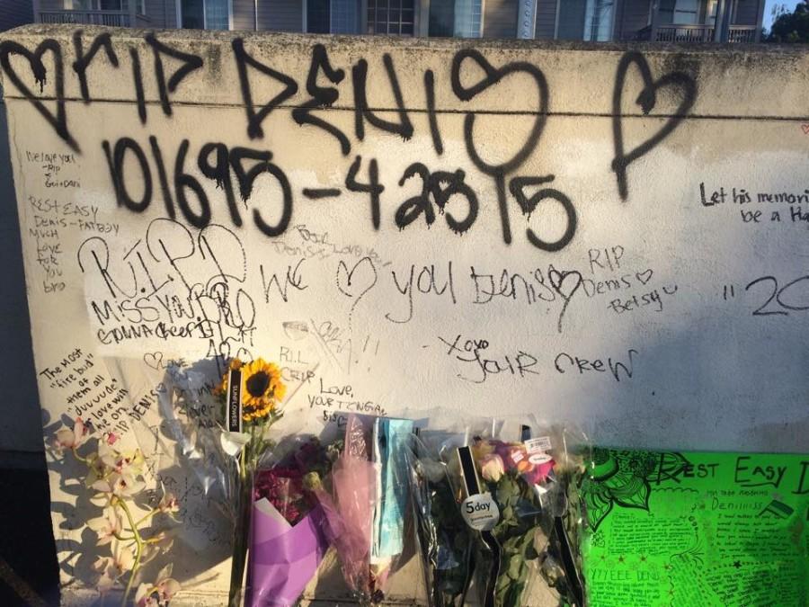 Meshchyshyns+friends+and+family+write+heartfelt+messages+on+the+wall+of+the+parking+lot+where+he+was+stabbed.+