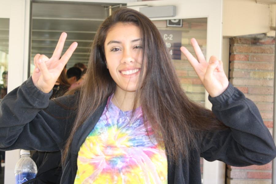 Sophomore Maya Paulo gave 70s vibes with her peace signs and tie dye on tie dye day.
