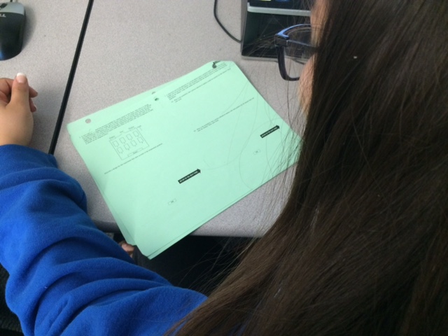 Student taking a practice AP statistics exam in preparation for the test. 