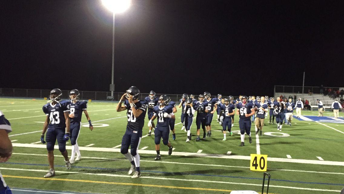 The Carlmont Scots exit the field after their hard fought game against the 
Aragon Dons.