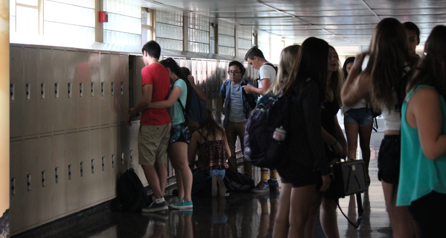 During the power outage, students congregate in the dark hall.