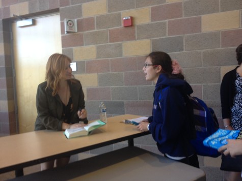 Freshman Alyssa Higdon meets Schneider after the book talk to get Schneiders autograph.