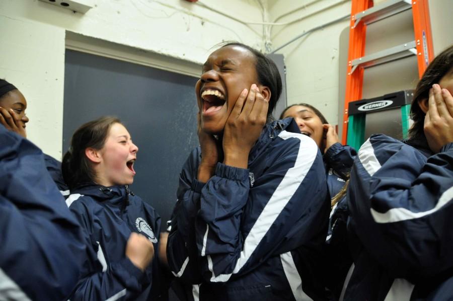 Senior and birthday girl Alexis Morrow leads the team through their pre-game scream tradition. 