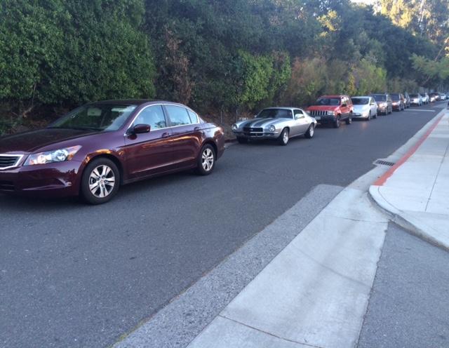During the morning drop-off, cars build up and form a traffic jam on the way out of school.