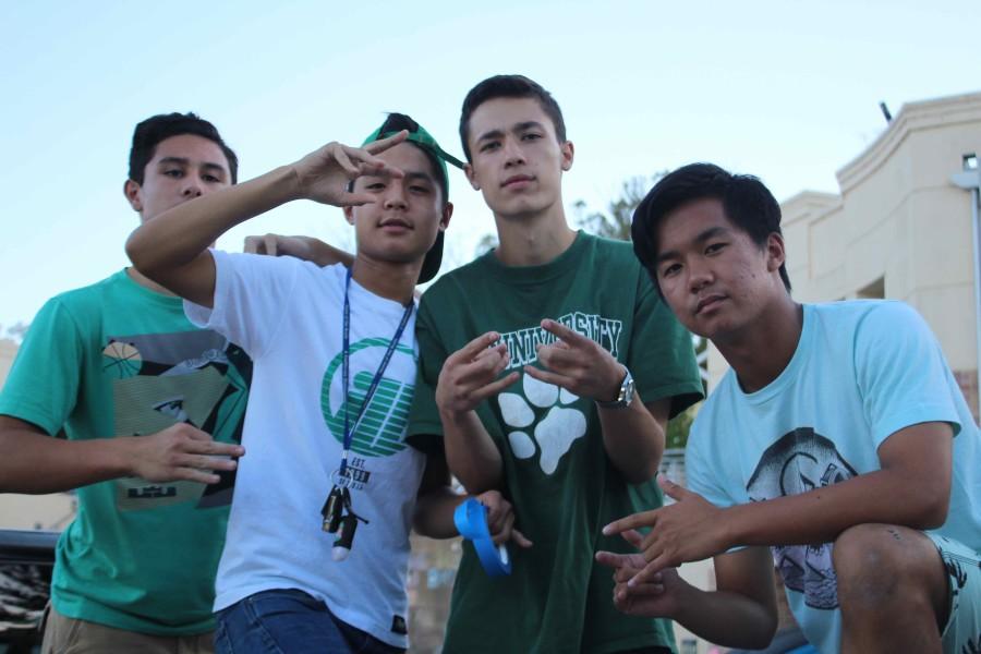 Juniors Spencer Enruquez, TJ Amigleo, Jason Jung , and Liam Jacson show their class color while getting ready to make the float. 