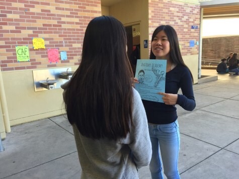 Sophomore Phoebe Zhang explains the goals of Anatomy Academy to an interested student.