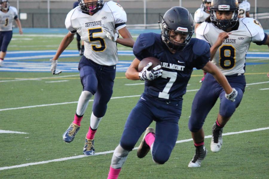 Sophomore Anthony Arteaga (7) runs down the side line at Carlmont in the fourth quarter.