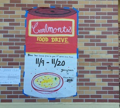 A poster imitating Campbells Soup hangs on Carlmont campus to urge students to donate to the food drive.