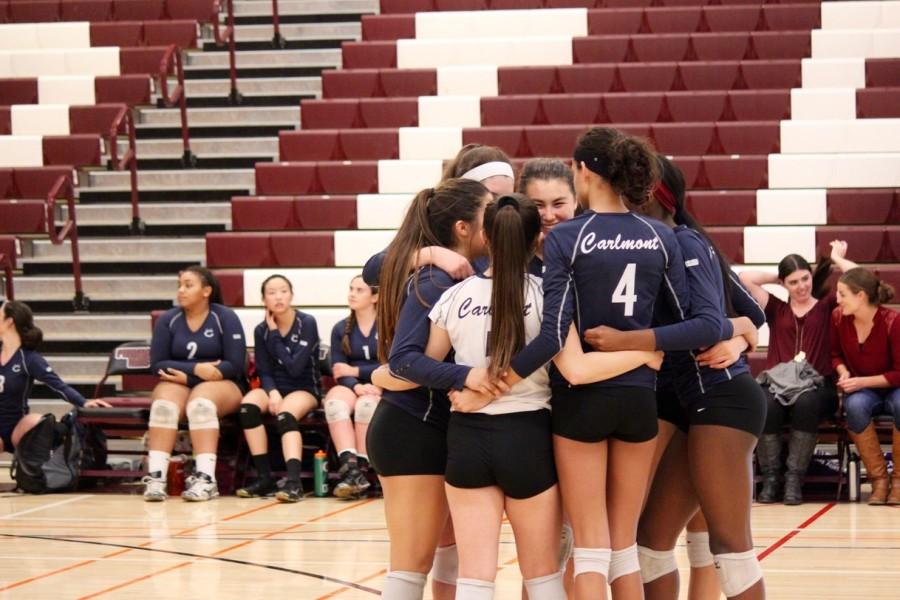 The players huddle on the court before the first game starts against Los Altos High School.