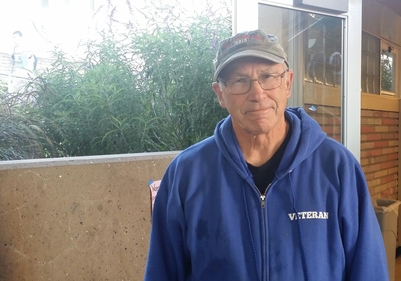 Victor Kottinger proudly wears his veterans hoodie. On the back, it states, I am a veteran. My oath of enlistment has no expiration date, displaying his commitment to the country.