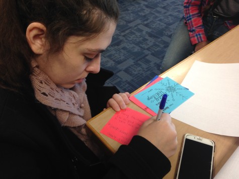 Senior Annie Klups takes advantage of free class time to write out thoughtful holiday grams for her friends. 