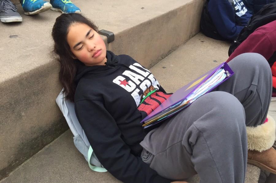 Sophomore Tyrese Lopez tries to catch up on sleep in the quad after a long night of doing homework.