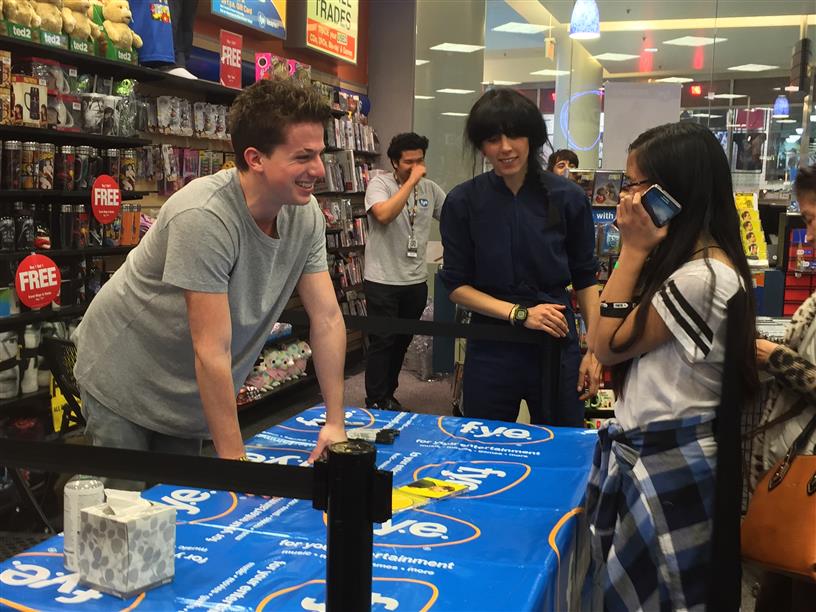 Charlie Puth greets an excited fan at a signing of his new debut album, Nine Track Mind, at the Shops of Tanforan Mall on Feb. 2.