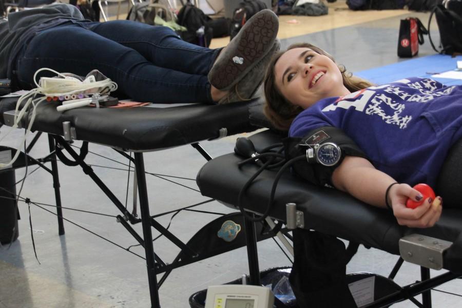 Senior Natalie Stainton donates blood for the first time. Stainton is one of the 75 donors who participated in the blood drive. 