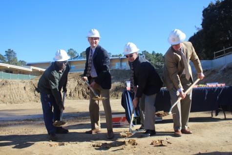 Plant Manager Jerome Harris, architech Carrick Boshart, Principal Ralph Crame, and Vice Principal Grant Steunenberg use the ceremonial groundbreaking shovels to dig into the ground where the Carlmont S wing will stand. 