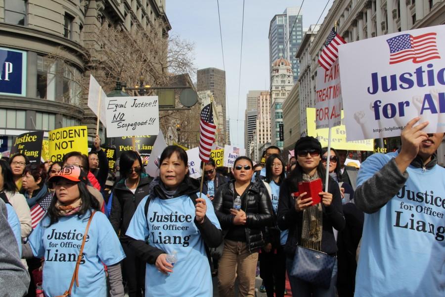 Protesters flock down Market St. in San Francisco, bringing attention to the conviction of Peter Liang.