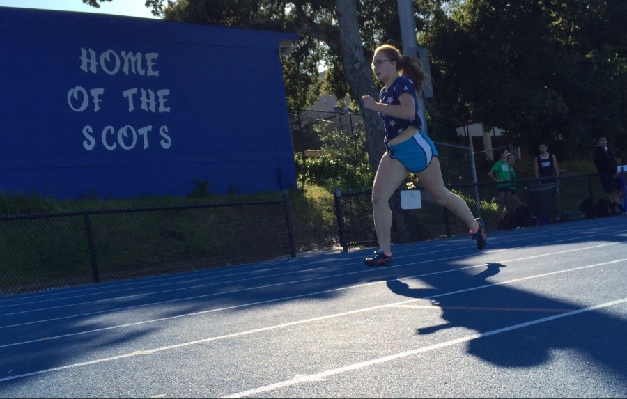 Sophomore Sasha Dolgashev runs toward the finish line during her event in the mock meet.