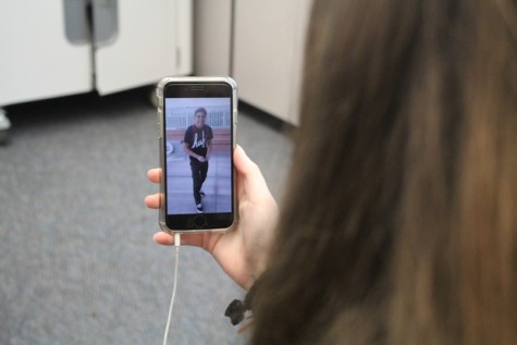 A Carlmont student watches the famous video of Daniel in his white Vans.